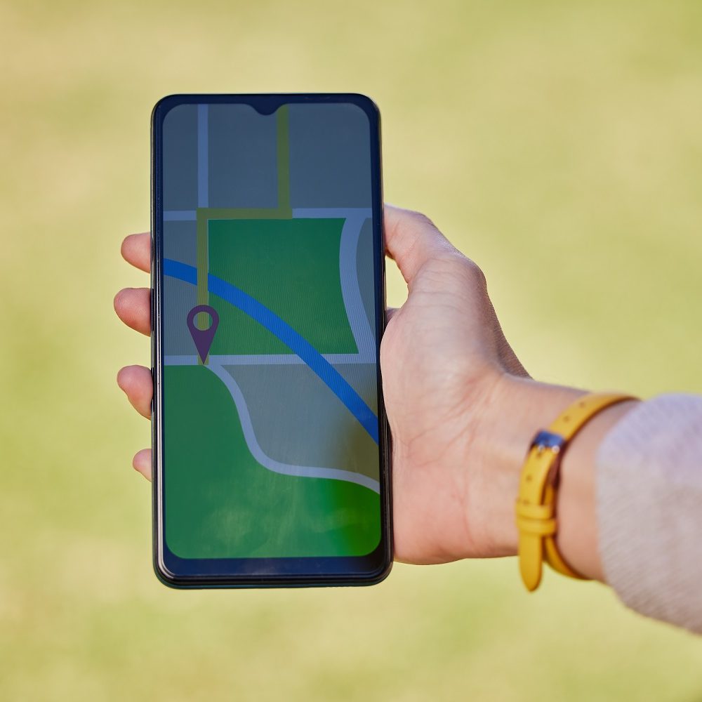 woman-hand-and-phone-for-travel-map-gps-or-sight-2023-01-31-04-29-11-utc